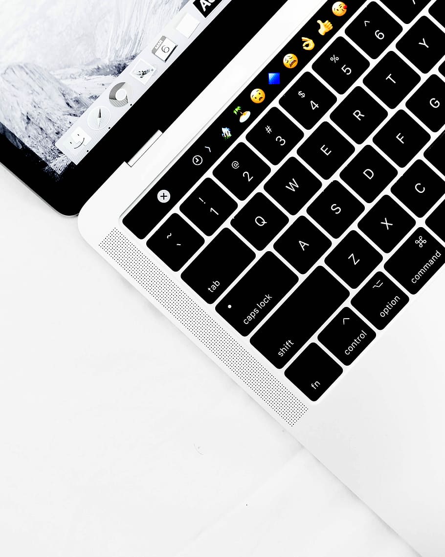 closeup photo of white and black laptop computer, silver and black MacBook Pro HD wallpaper