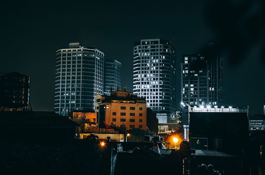 high-rise buildings during night time, black and gray concrete buildings during night time HD wallpaper