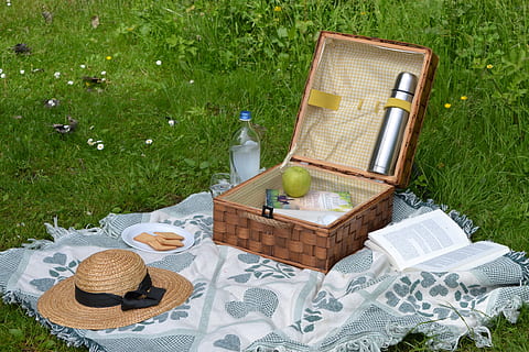 wicker brown picnic basket on grass with sun hat, book, summer HD wallpaper