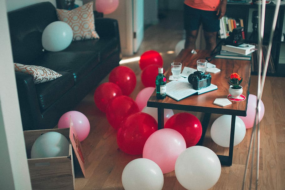 Red + White, red and white balloon under the brown wooden table HD wallpaper