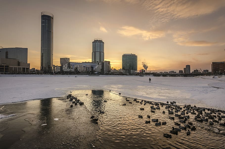 frozen lake beside city, body of water near high-rise building, HD wallpaper