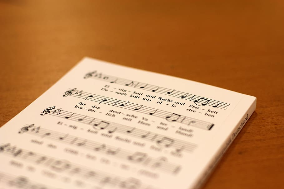 selective focus photography of music notebook, National Anthem, HD wallpaper