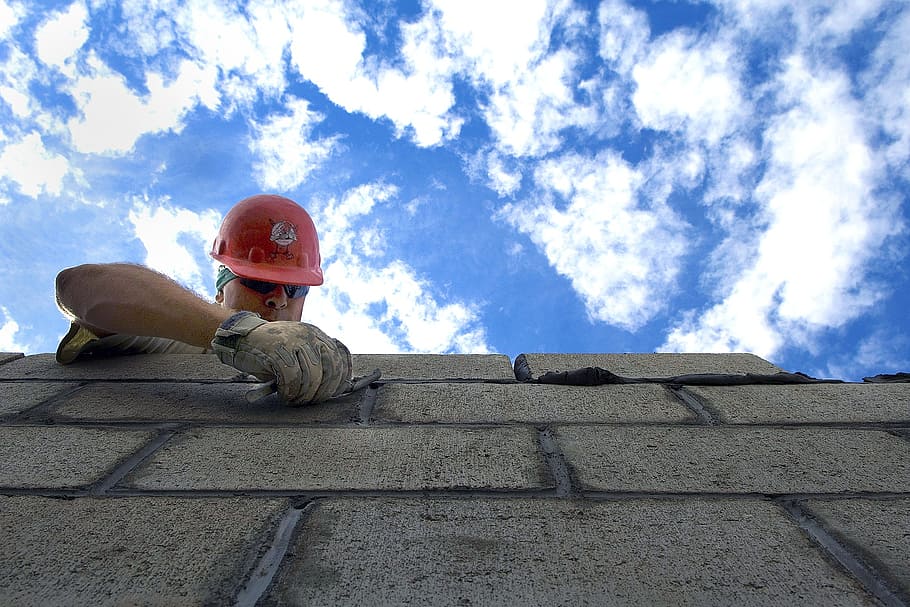 man in red hard hat on top of cinder block, sky, clouds construction HD wallpaper