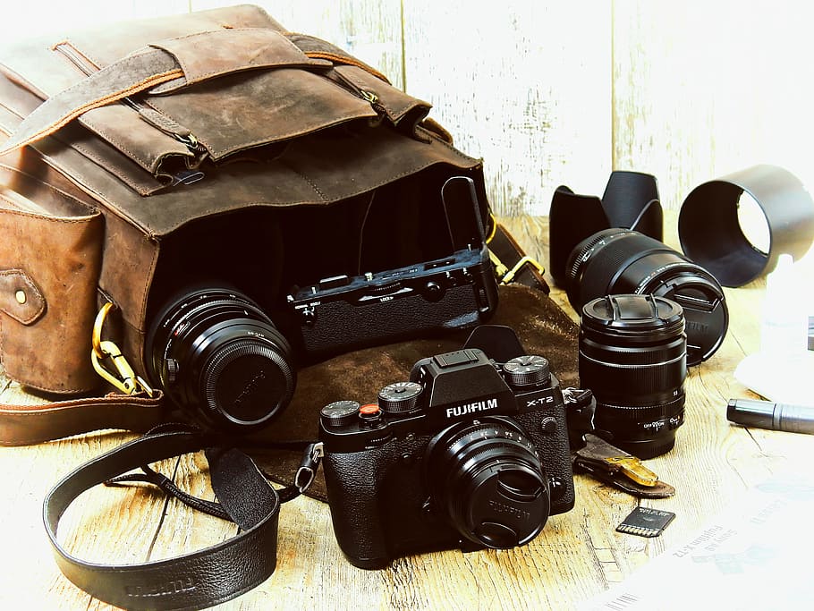 black Fujifilm camera with lenses beside brown bag, fs, dslm, HD wallpaper