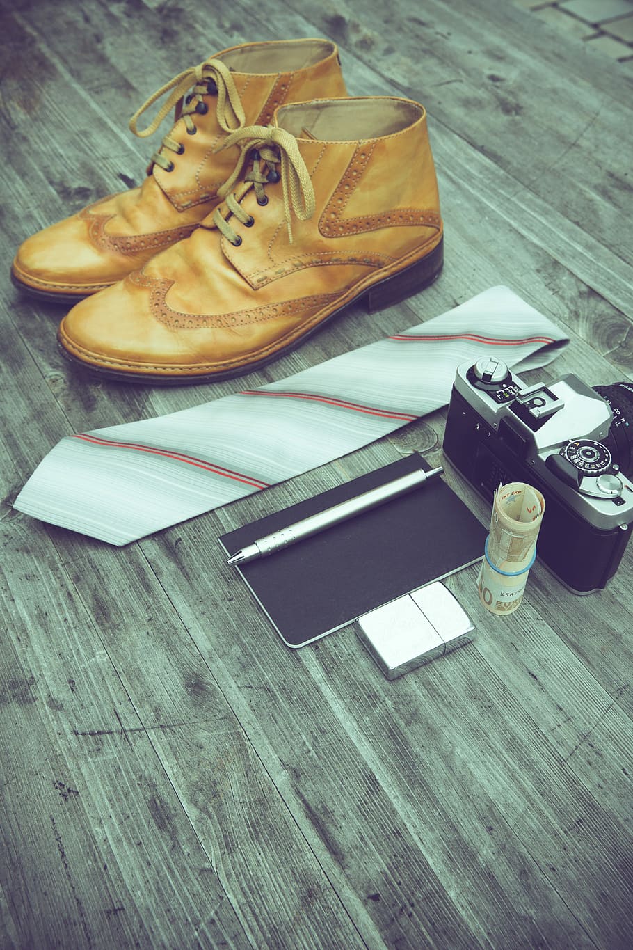 pair of brown boots, pair of brown leather shoes, necktie, MILC, pen, and money on parquet floor HD wallpaper