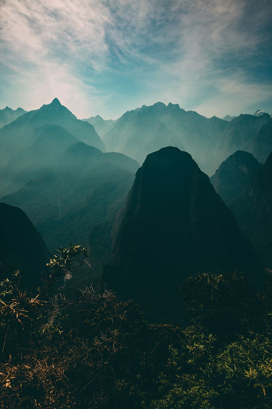 aerial photo of mountains and mist, aerial photography of mountain under white sky at daytime HD wallpaper