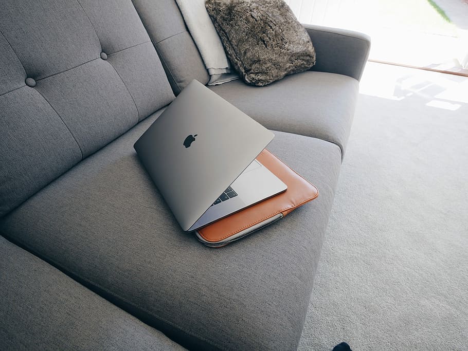 silver MacBook, silver MacBook Pro on top of the sofa, minimalist HD wallpaper