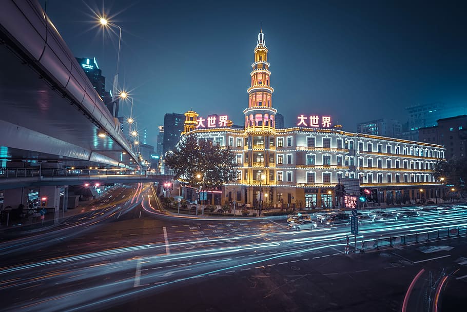 timelapse photography of city building during nighttime, time lapse photography of road near buildings HD wallpaper