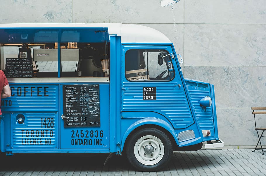 blue food truck, blue and white coffee truck parked near white cement wall during daytime HD wallpaper