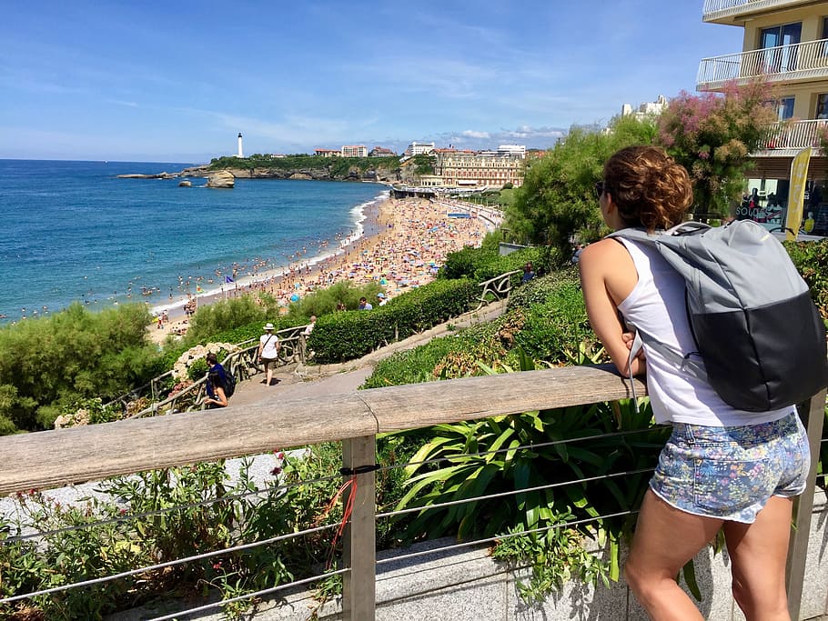 Woman In White Tank Top Leaning On Railing, backpacker, beach HD wallpaper