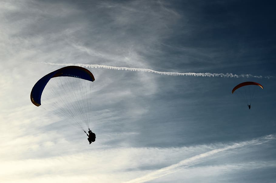 two people riding parachute on clouds during daytime, parachuting people in the air HD wallpaper
