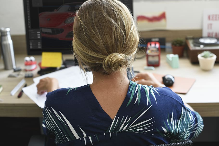 woman sitting in front of desk holding papers, workspace, workplace HD wallpaper