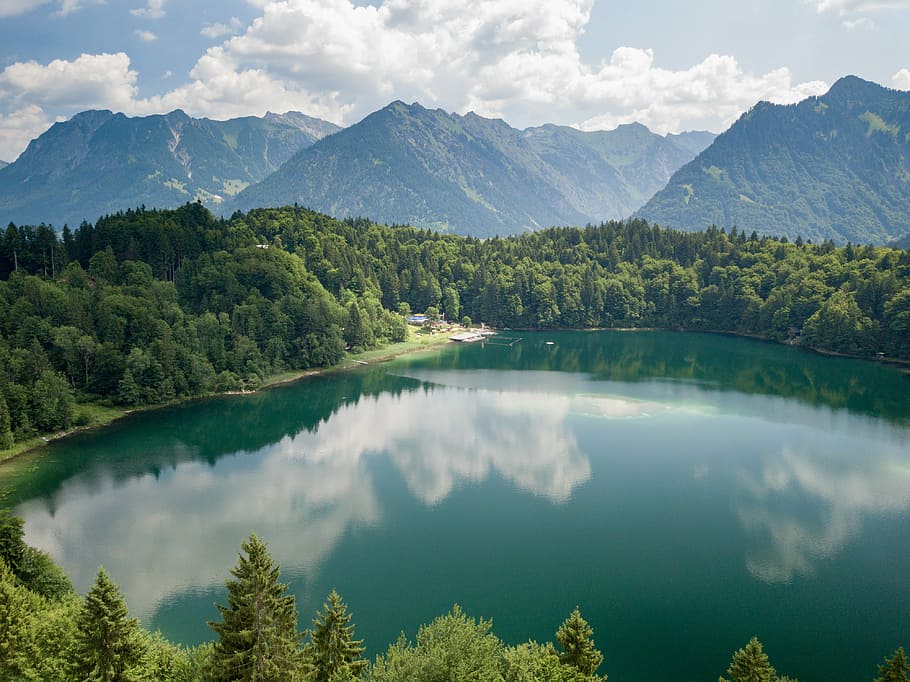 Freibergsee, body of water near tree under cloudy sky, mountain range HD wallpaper