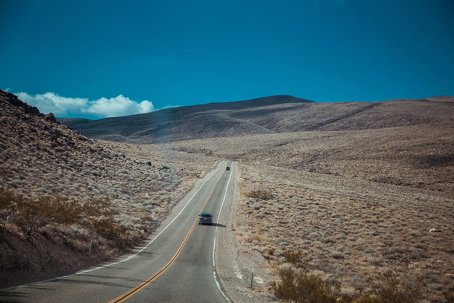 black car traveling on road, path, mountain range, sky, blue HD wallpaper