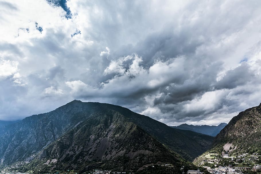 time lapse photography of clouds over mountain, mountains under cloudy sky at dayitme HD wallpaper