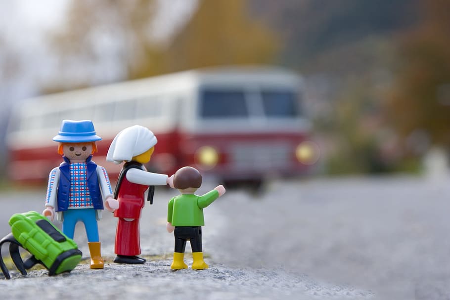 selective focus photography of Lego minifig toys, selective focus photography of three plastic toys near bus, HD wallpaper