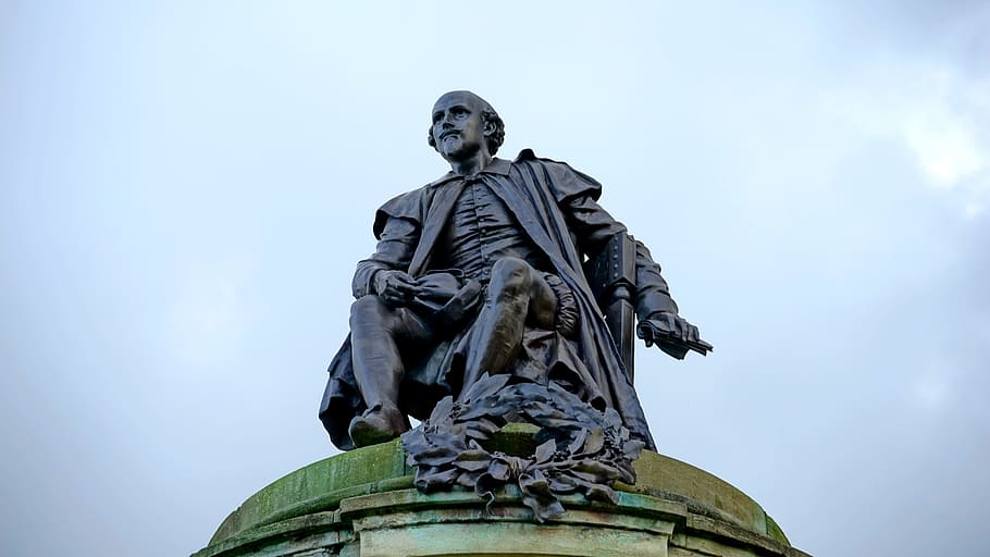 man sitting on chair statue under cloudy daytime, William Shakespeare