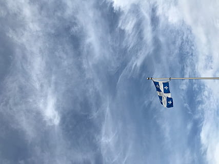 Quebec flag, white and blue with cross flag with sky as background HD wallpaper