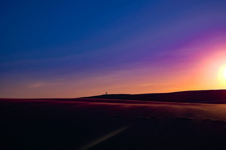 silhouette on two persons on dune, desert during sunset, sunrise HD wallpaper