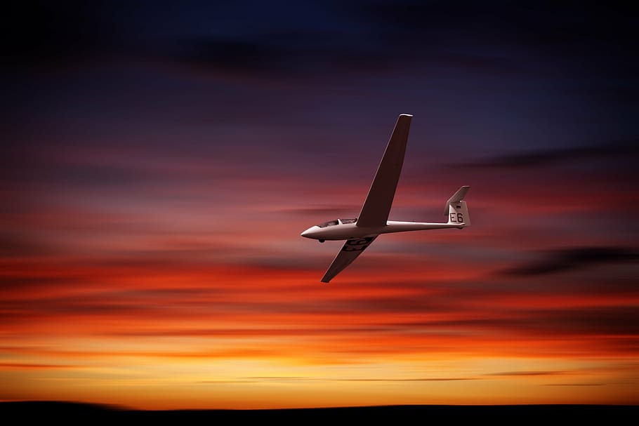 airplane flying during golden hour, glider, afterglow, sunset