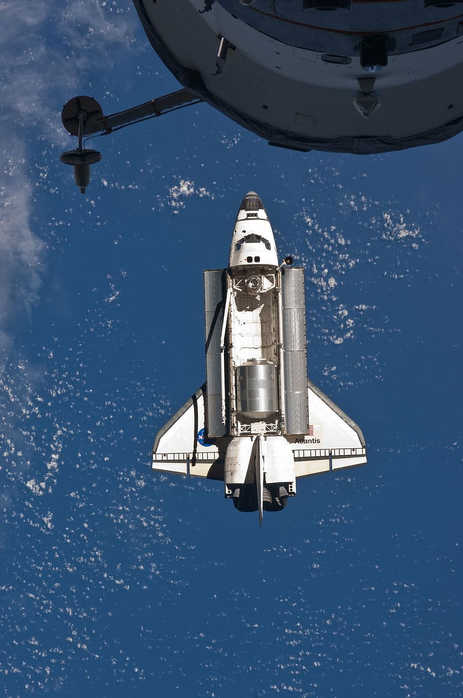 white space shuttle in outerspace, atlantis, docking, preparation