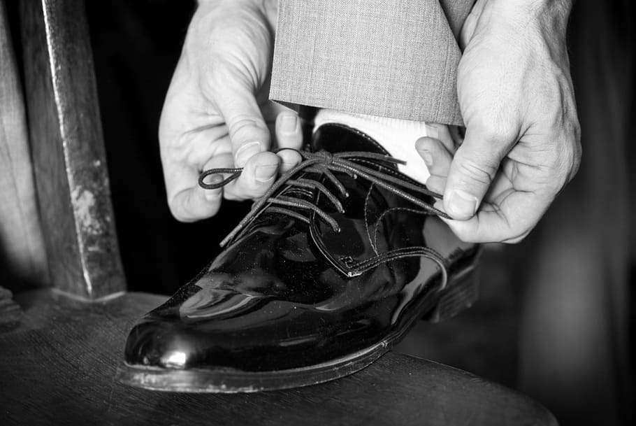 greyscale photo of dress shoe, wedding, shoes, tying shoe, man