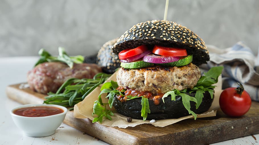 black hamburger beside tomato, black bread, vegetarian, kitchen HD wallpaper