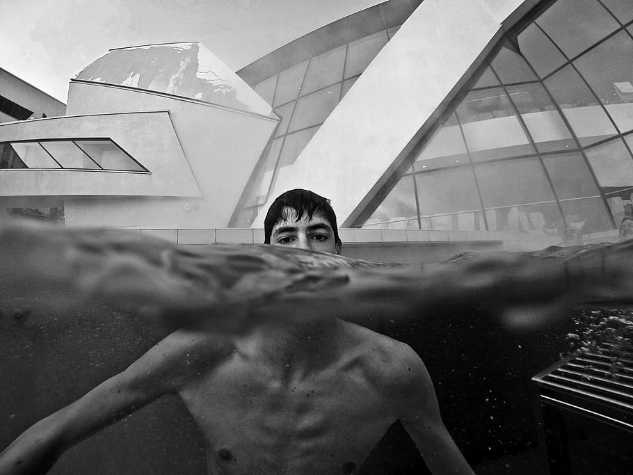 man sticking out head above water, grayscale photography of man on water, HD wallpaper