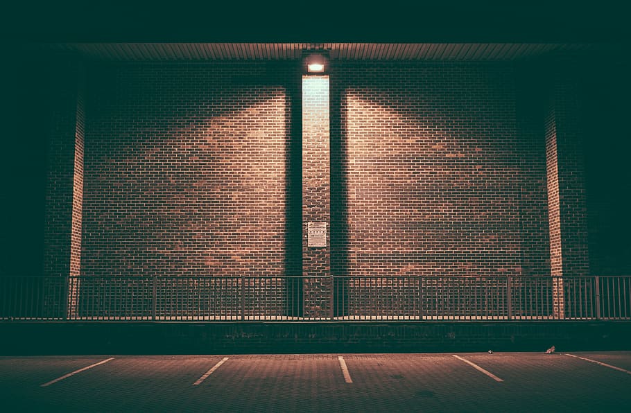 brown concrete wall, brick wall, empty, lighted, night, parking area HD wallpaper