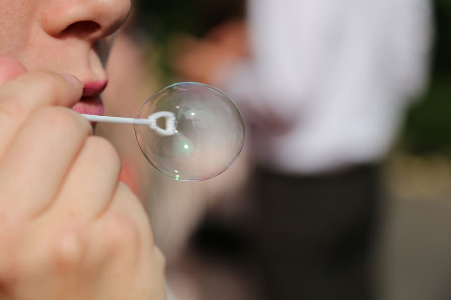 person making bubble, soap bubble, breath, reflection, hand HD wallpaper