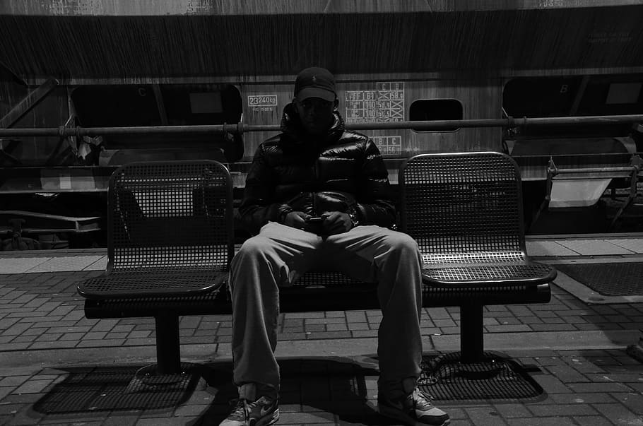 grayscale view of man sitting on gang bench, young, guy, hat HD wallpaper