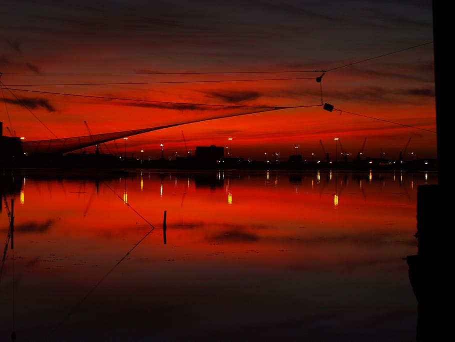 sunset, skyline, backlight, reflection, water, waterfront, cloud - sky HD wallpaper