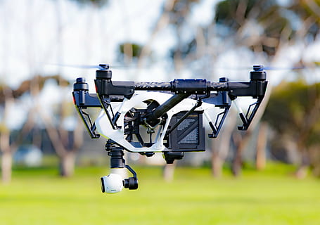 shallow focus photography of black and white quadcopter drone HD wallpaper