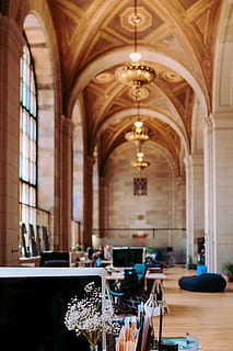 Unsplash HQ, Crew collective & Cafe, Montreal, brown wooden desks inside brown arch ceiling building HD wallpaper