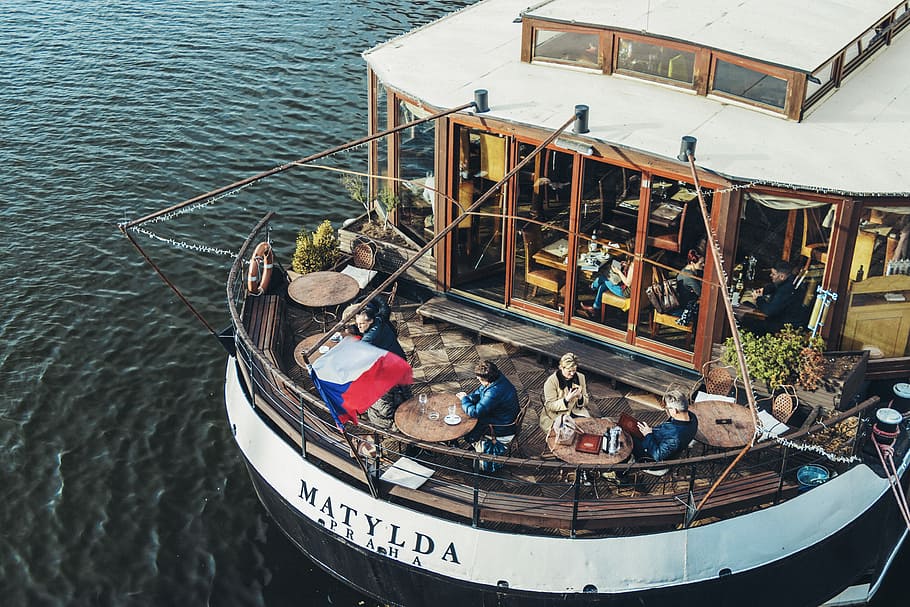Matylda watercraft, people sitting on bistro chair set in ship HD wallpaper