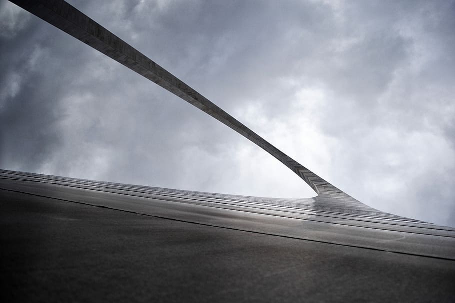 greyscale low-angle photography of arc gate under cloudy sky, untitled HD wallpaper