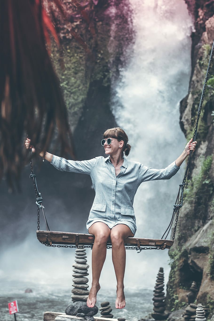 woman sitting on brown wooden swing, photo of woman on swing with waterfall background HD wallpaper