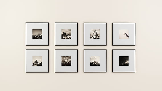 eight square black wooden photo frames on white painted wall HD wallpaper