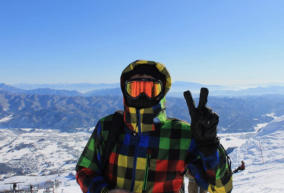 man raising his right arm with peace sign, ski, snowboard, skiing HD wallpaper