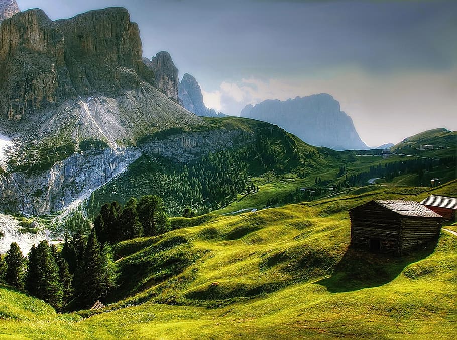 landscape photo of shack on hill near mountains, dolomites, south tyrol