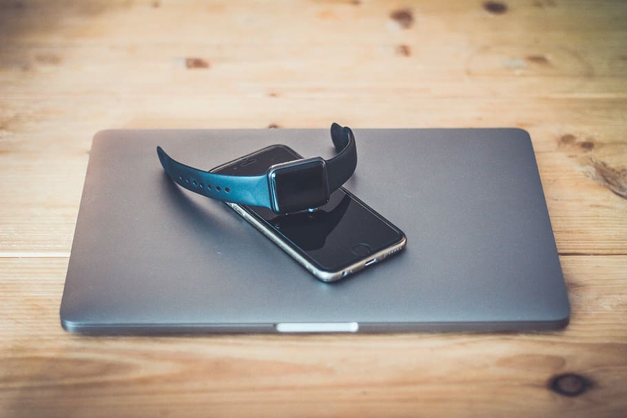 space gray Apple Watch on top of gray laptop computer, space gray aluminum case Apple Watch with black Sport Band on top of space gray iPhone 6 and space gray MacBook, HD wallpaper