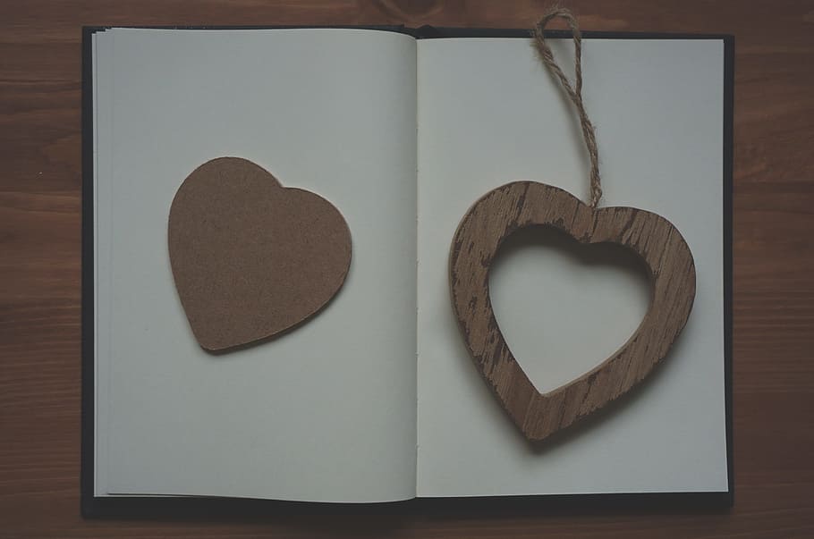 brown heart wood hanging decor on opened book, wooden, notebook HD wallpaper