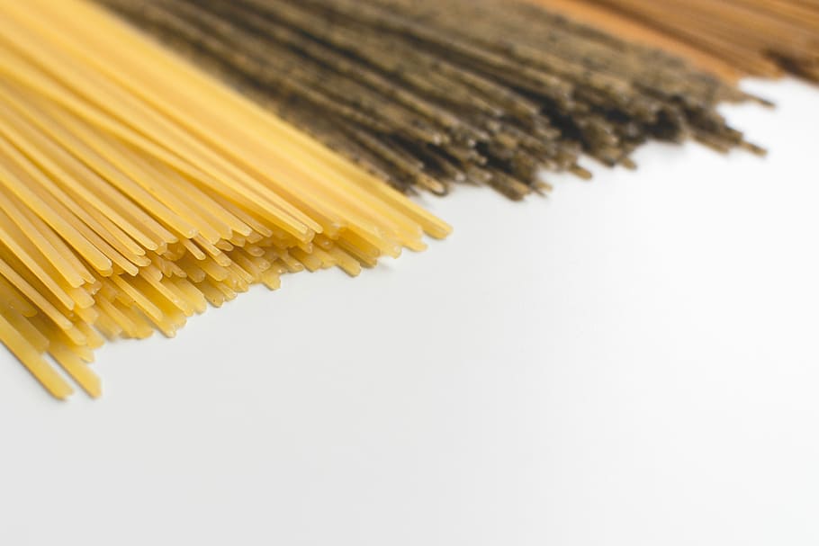 Spaghetti tricolora, white background, pasta, yellow, close-up HD wallpaper