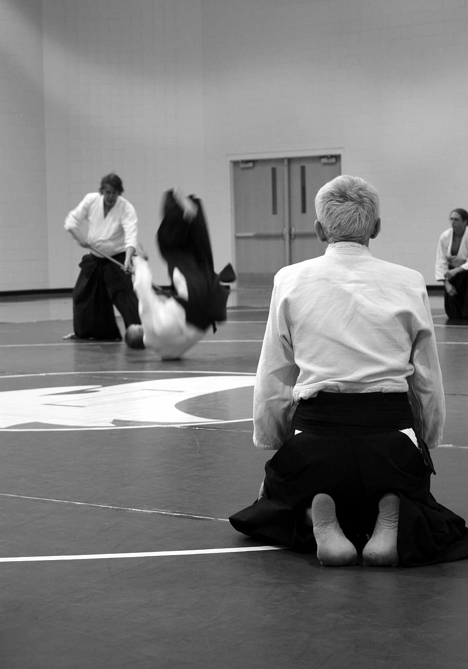 grayscale photo of man kneeling on floor, aikido, martial arts