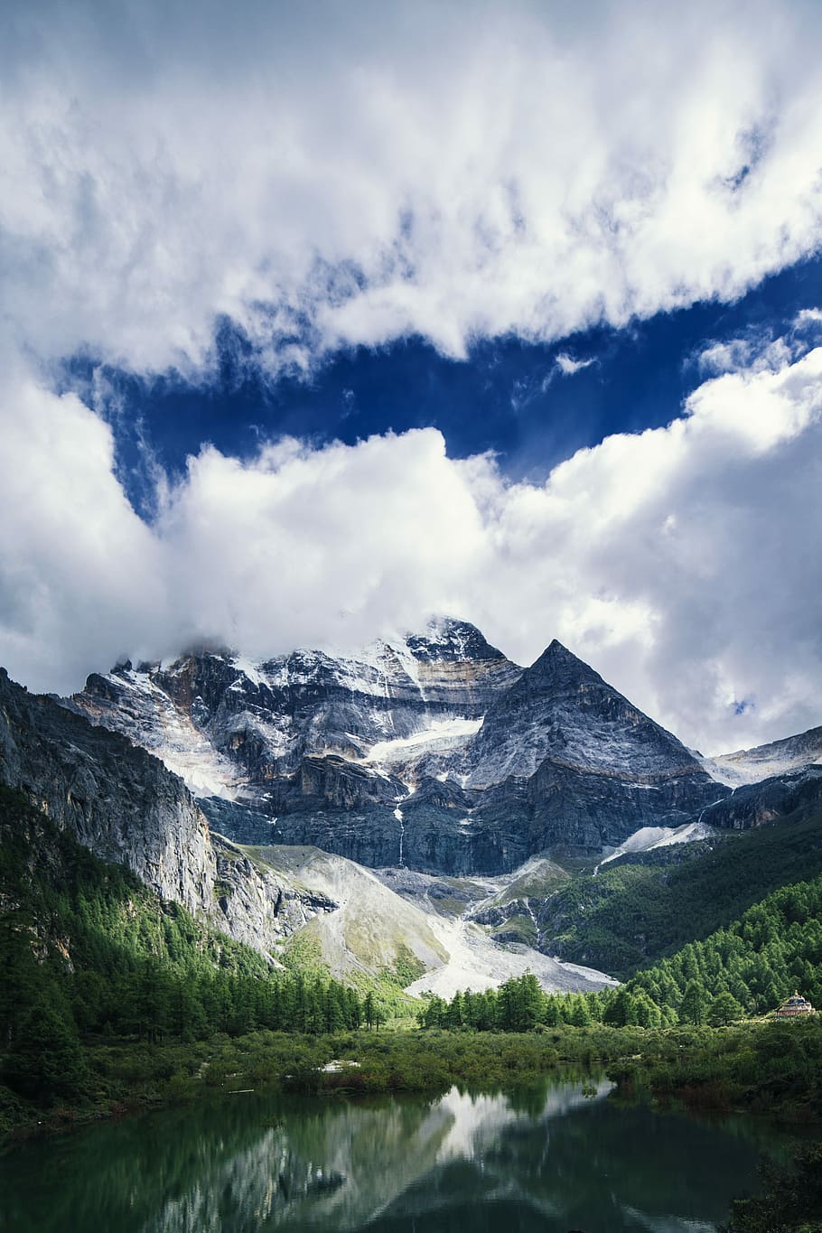 landscape photography of mountains, plants, and river under clouds, mountain range under clouds HD wallpaper