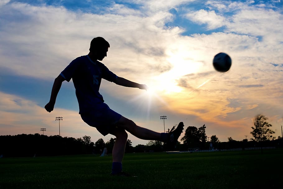 HD wallpaper: silhouette photography of man kicking ball, soccer, sunset,  sport | Wallpaper Flare