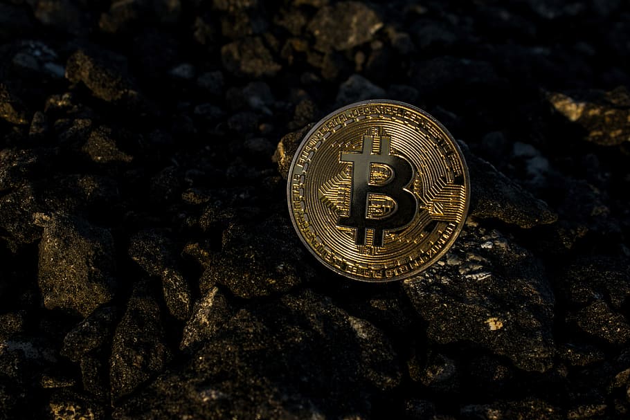 bitcoin on soil pavement, cryptocurrency, finance, blockchain