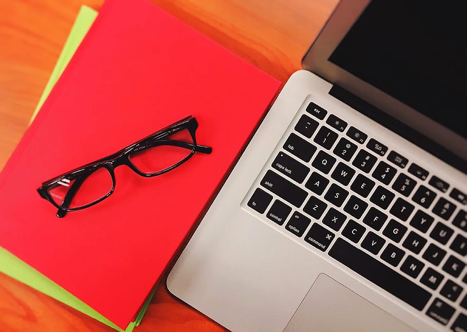 MacBook Air beside red book, computer, laptop, office, technology HD wallpaper