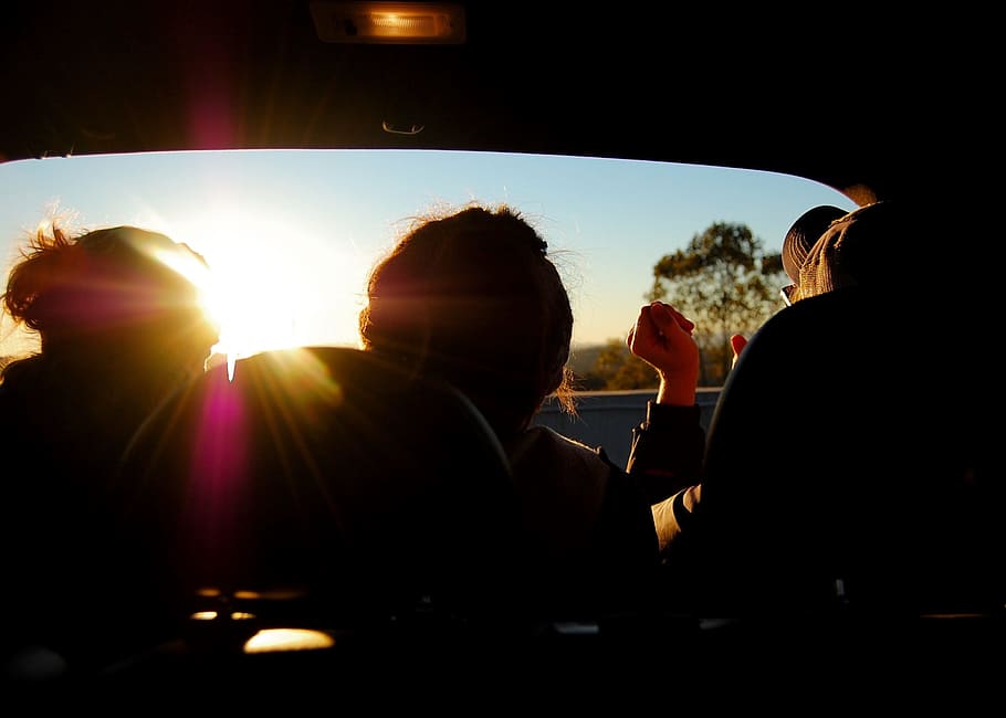 silhouette of three person inside car, sun rays through the car, HD wallpaper