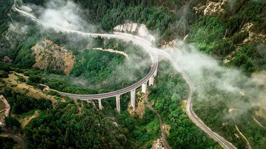 Going Underground, aerial photography of wining road surrounded with trees HD wallpaper